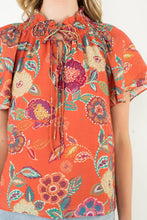 Load image into Gallery viewer, Orange Floral Tie Neck Top
